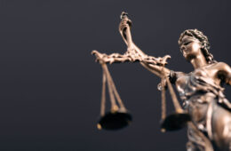 Photo of a statue of lady justice holding scales