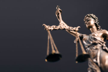 Photo of a statue of lady justice holding scales