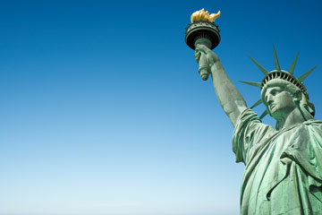 Photo of the Statue of Liberty against a blue sky