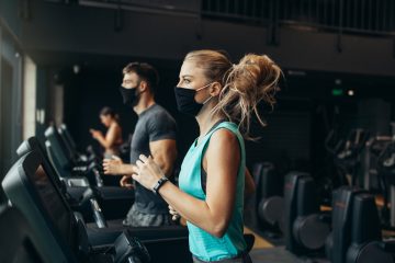 Sporty people exercising in fitness gym