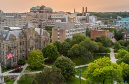 Photo looking down on the Case Quad with an orange-hued sky