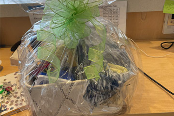 Photo of a gift basket wrapped in clear plastic