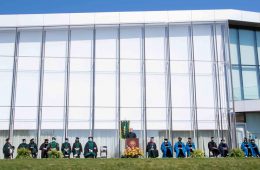 Photo showing the School of Medicine platform party with the Tinkham Veale University Center in the background