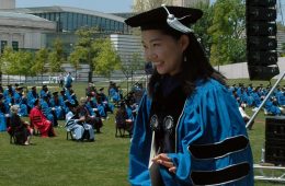 Photo of a smiling School of Law graduate