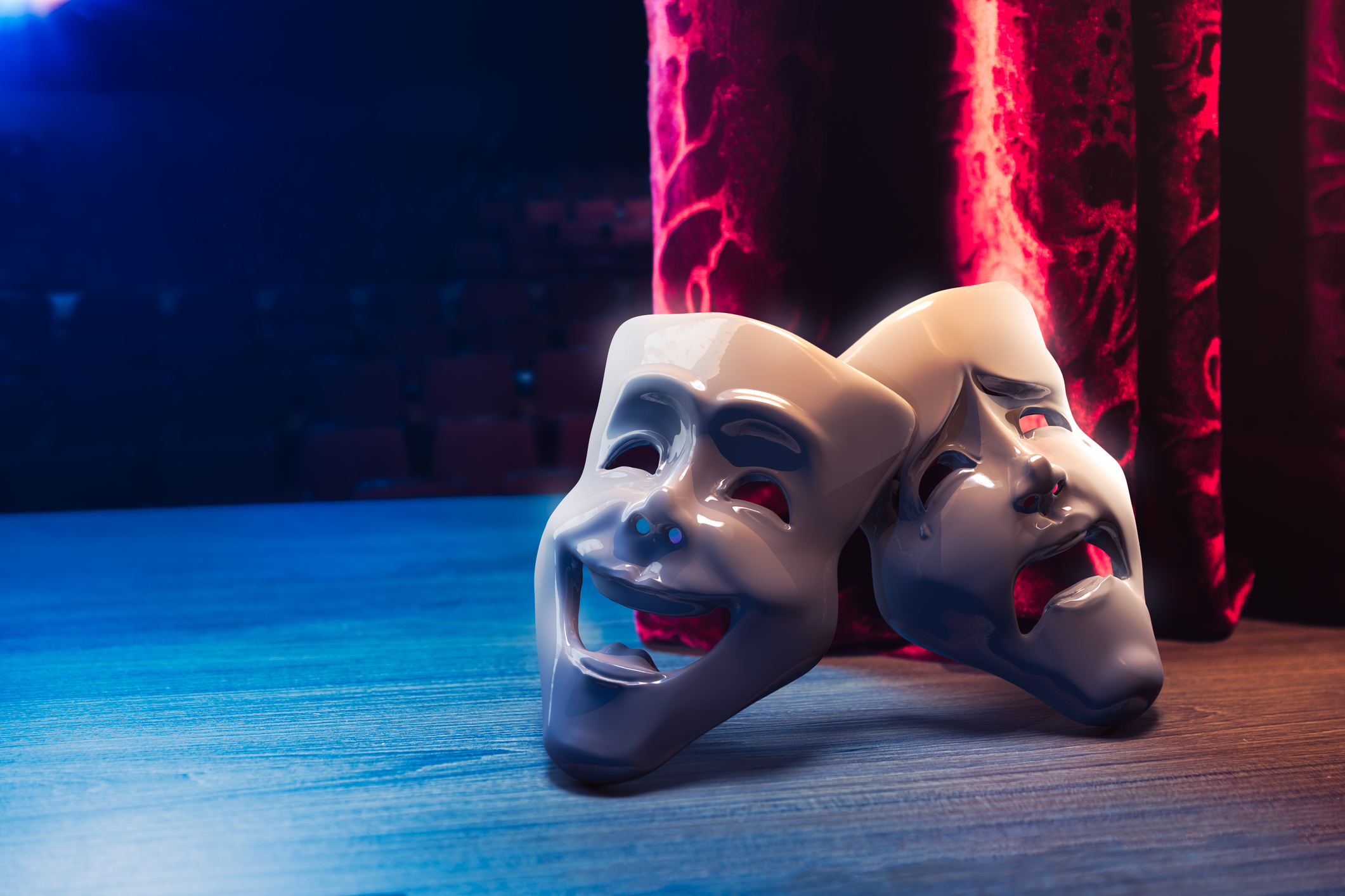 Theater masks in front of a red curtain/ 3D rendering