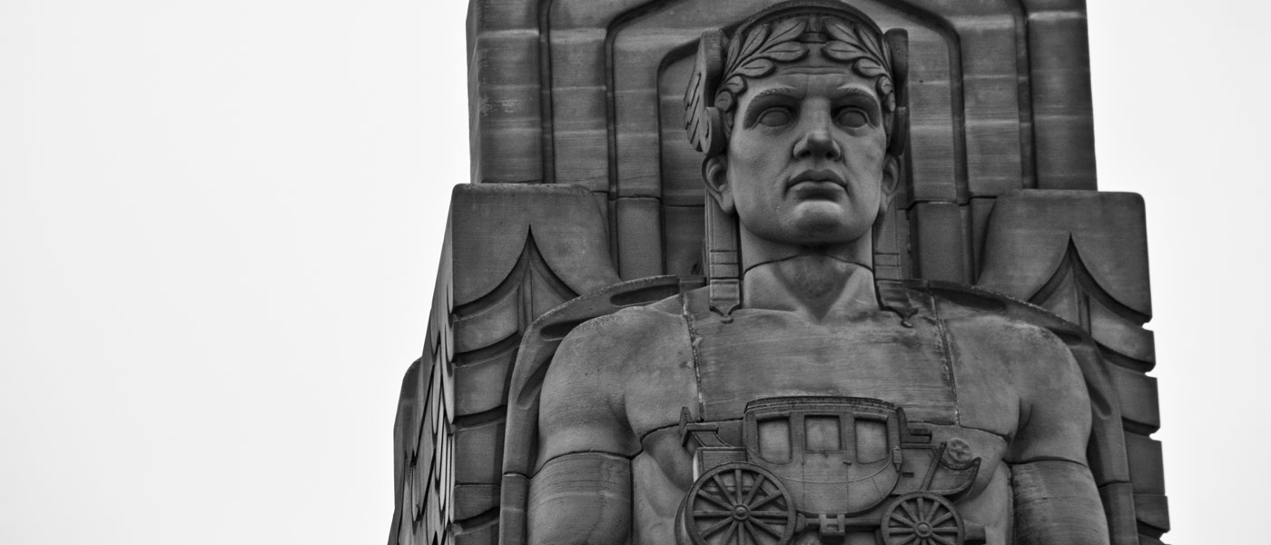 Black and white photo showing the top of one of the Guardians of Traffic sculptures