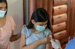 Girl getting a COVID-19 vaccine at her rural house