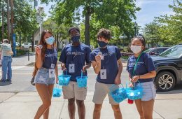 A group of CWRU students together wearing masks