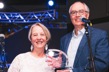 Photo of Jan and David Abbott holding an award