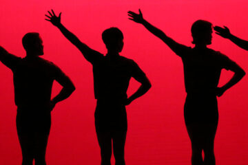 silhouette of five dancers with one hand on their hip and the other outstretched, all against a red background