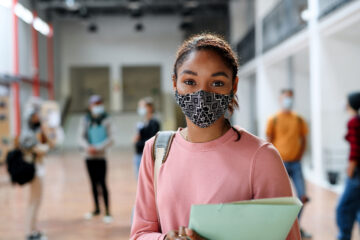 African-american student with face mask