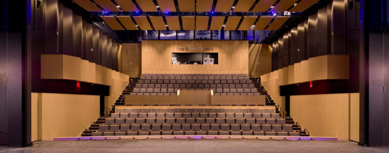 Photo of the Roe Green Theatre taken from the stage looking out at the seats