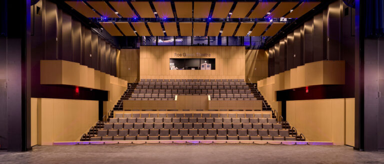 Photo of the Roe Green Theatre taken from the stage looking out at the seats