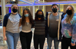 Photo of five members of CWRU Amnesty International posing for a photo together while wearing masks