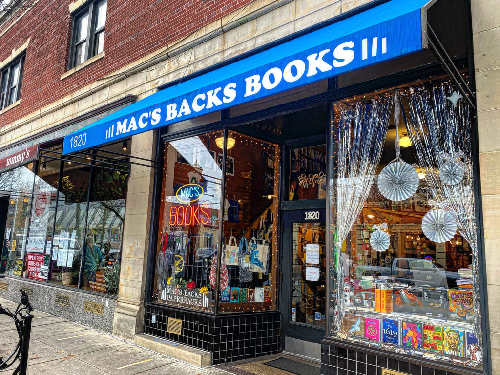 The exterior of Mac's Backs next to Tommy's Restaurant