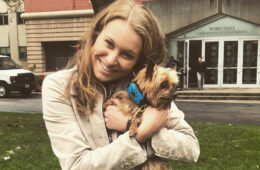 Photo of Madeline Myers holding a dog