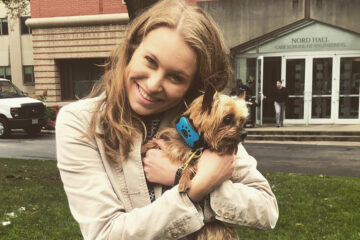 Photo of Madeline Myers holding a dog