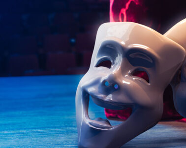 Photo of theater drama masks on a stage