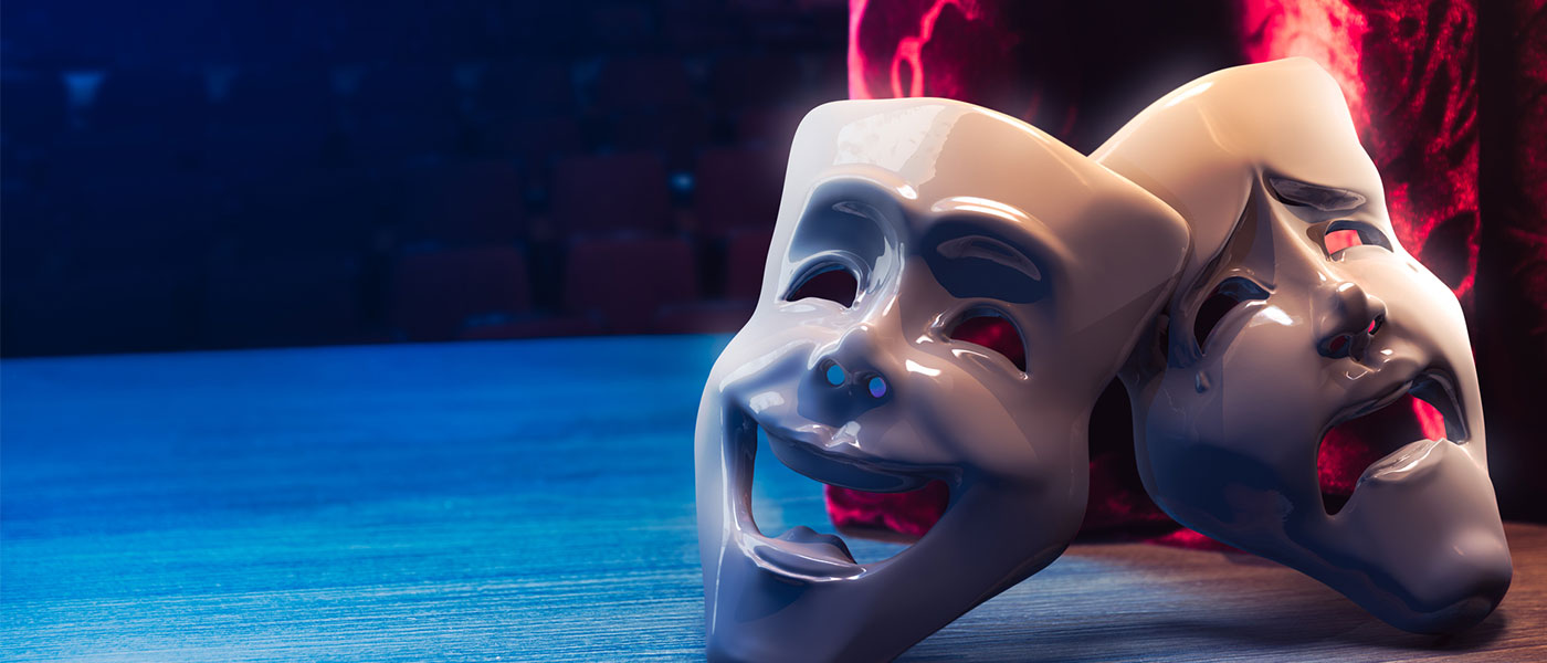 Photo of theater drama masks on a stage