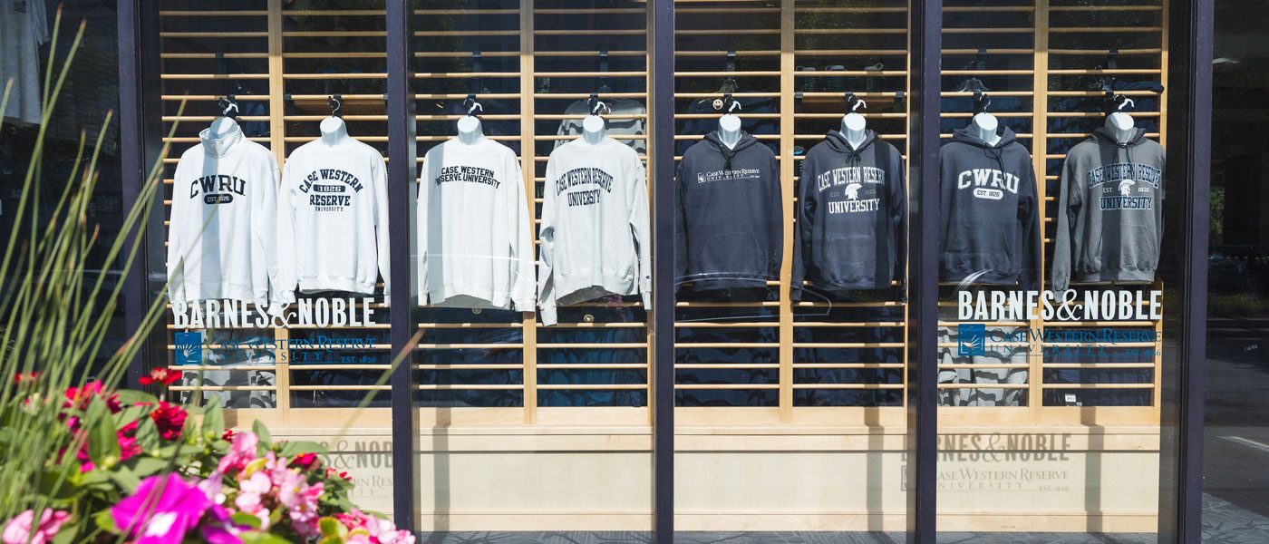 Photo of the front window of the CWRU bookstore showing CWRU gear