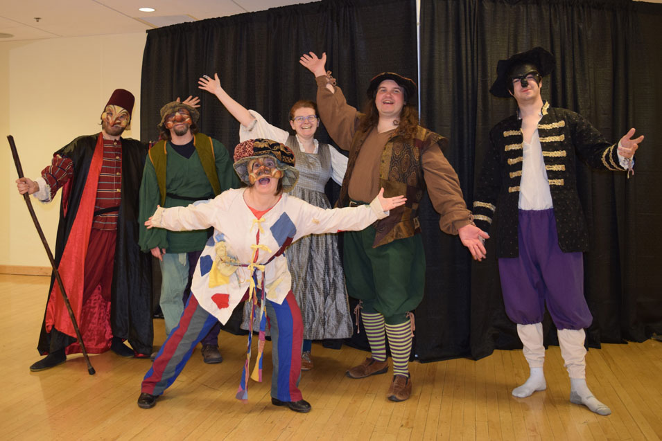 Photo of Jess Rudolph striking a pose in costume with other members of The Confused Greenies of Players' Patchwork Theatre Company