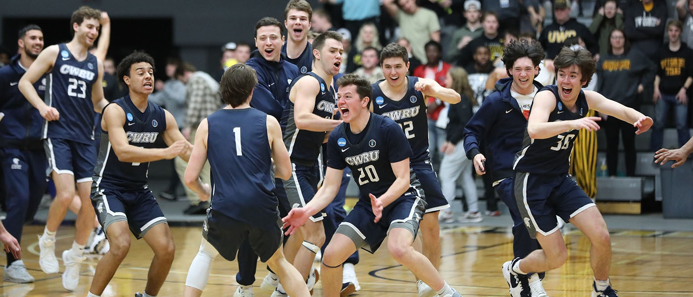 Photo of Case Western Reserve University 2022 Men's Basketball team cheers on the court after NCAA tournament win