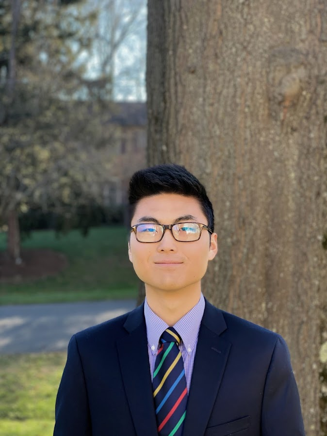 Case Western Reserve University student Winston Li standing outside next to a tree