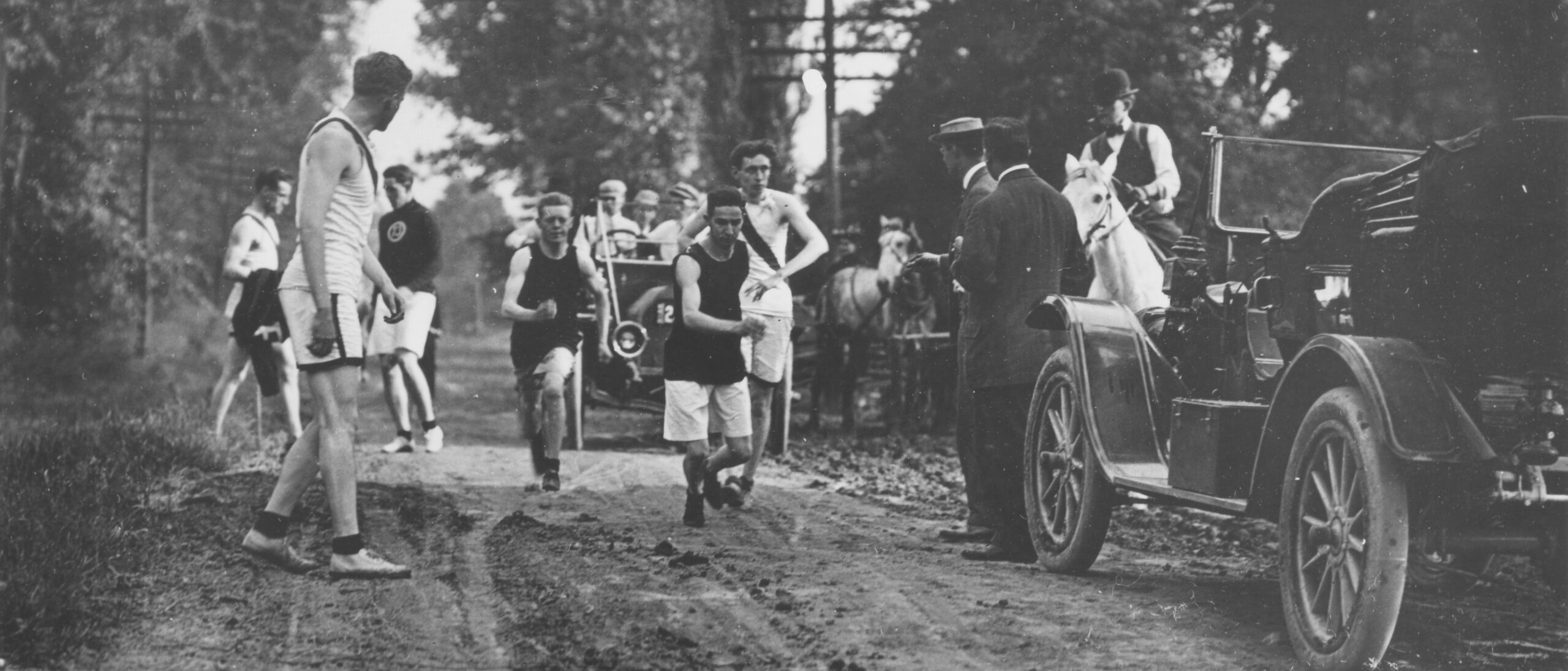 Black and white photo of two men starting their leg of the Hudson Relays at the 1911 event.