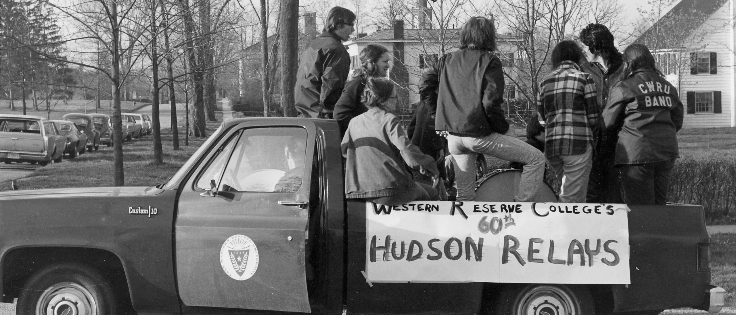 Black and white photo of the 1974 pep band in back of a pickup truck.