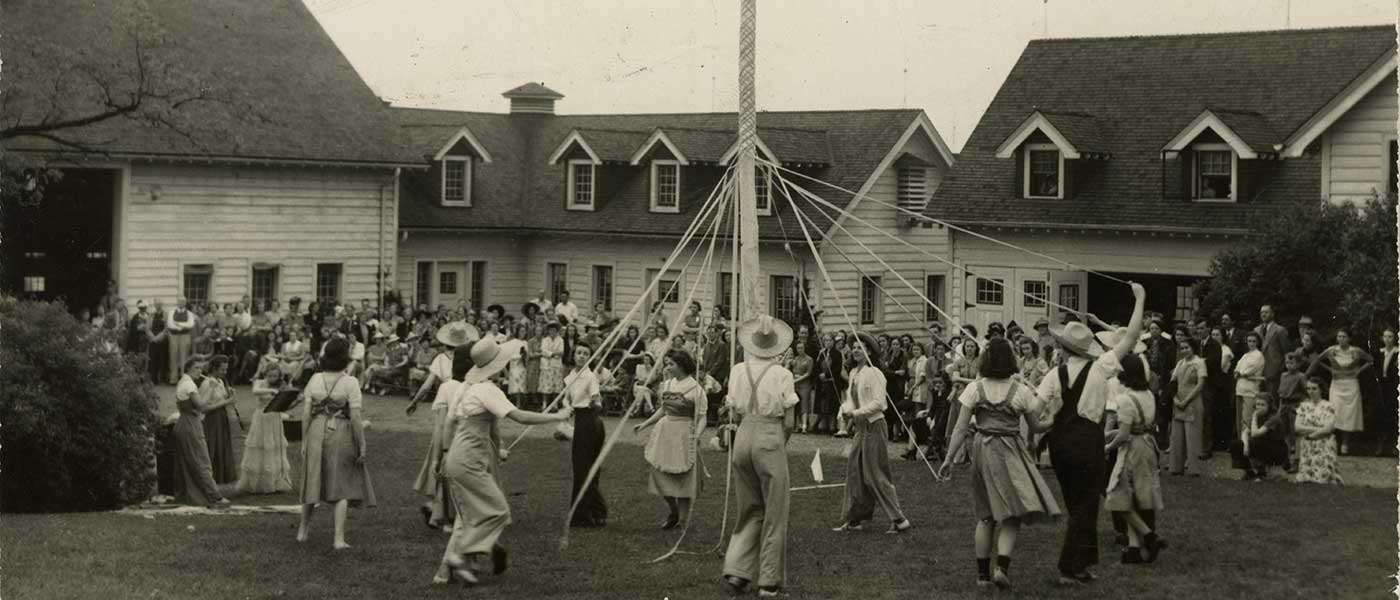 A group of students dance around maypole on May Day in 1940.
