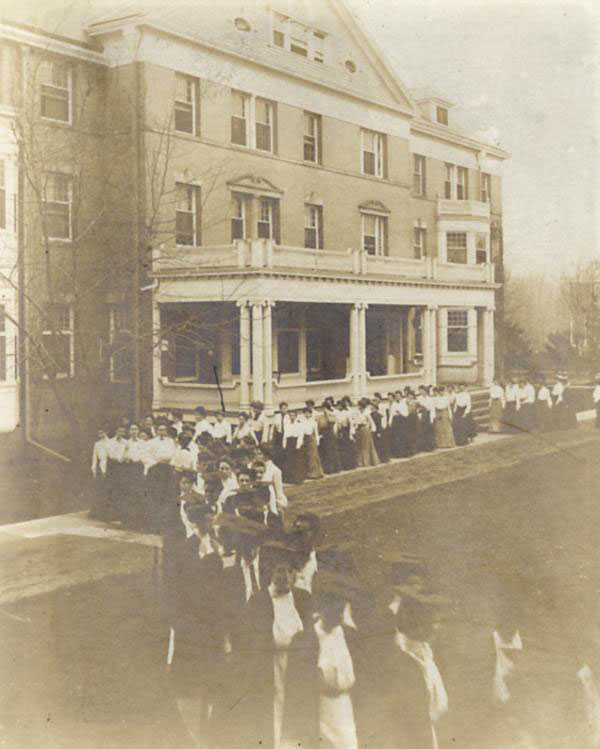 A group of graduates during a commencement procession for the College of Women between 1890-1899.