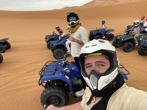 Photo of Joaquin Mendoza and others on four-wheelers in the desert
