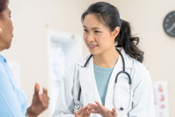 A patient talks with a doctor at a medical appointment