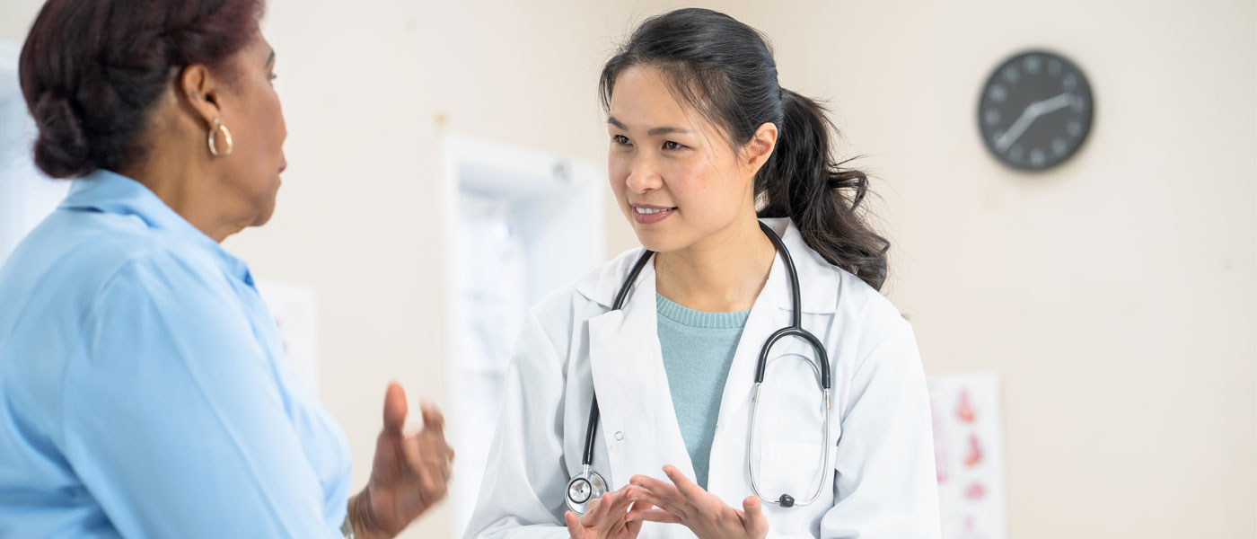 A patient talks with a doctor at a medical appointment