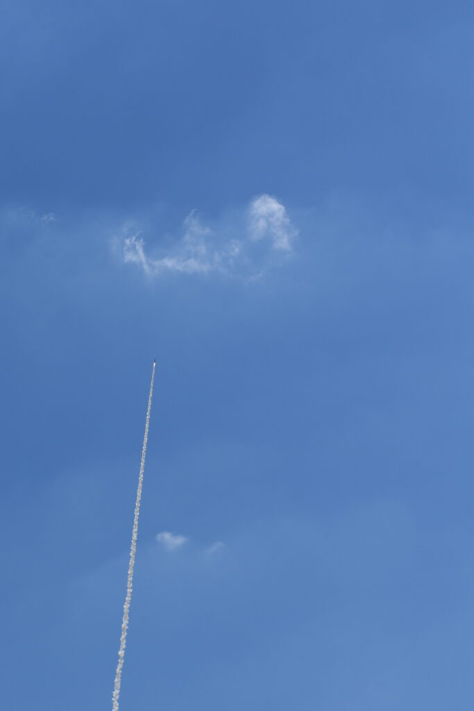 Photo showing Case Rocket Team's rocket flying high against a blue sky