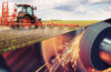 Photo composite image of a tractor in a field and another of a machine grinding metal in a manufacturing setting