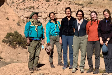 A group of researchers poses for a photo while conducting fieldwork in Bolivia