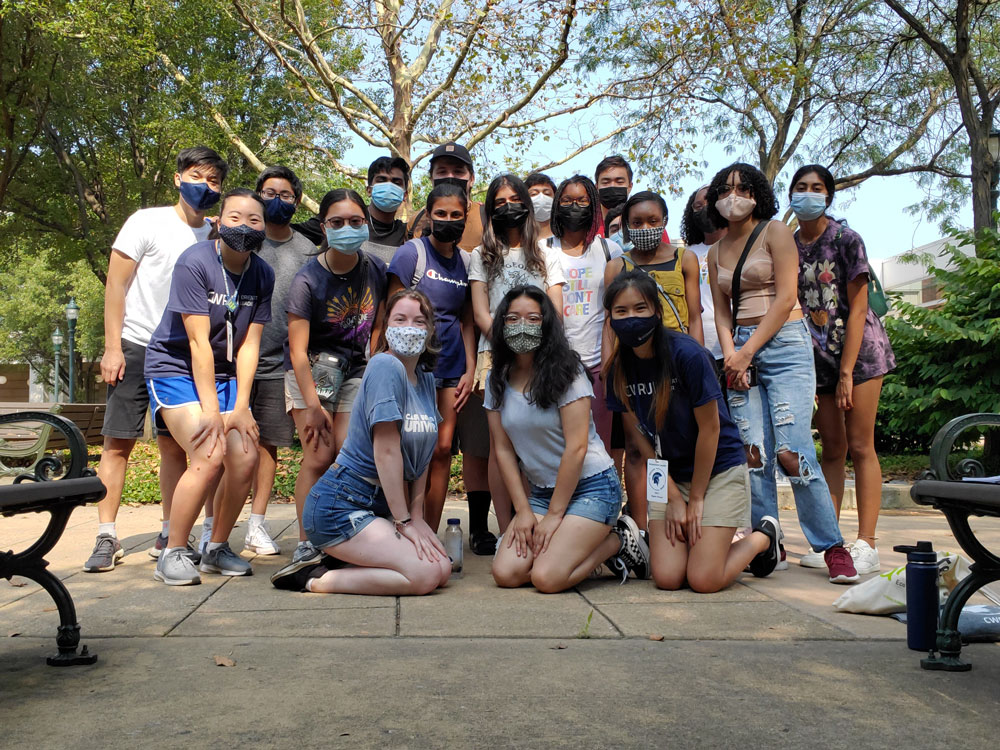 Michelle Tun poses for a photo with her 2021 orientation group with all students wearing masks