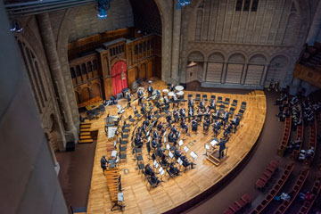 Photo taken from above of the CWRU Symphonic Winds on stage at the Maltz Performing Arts Center