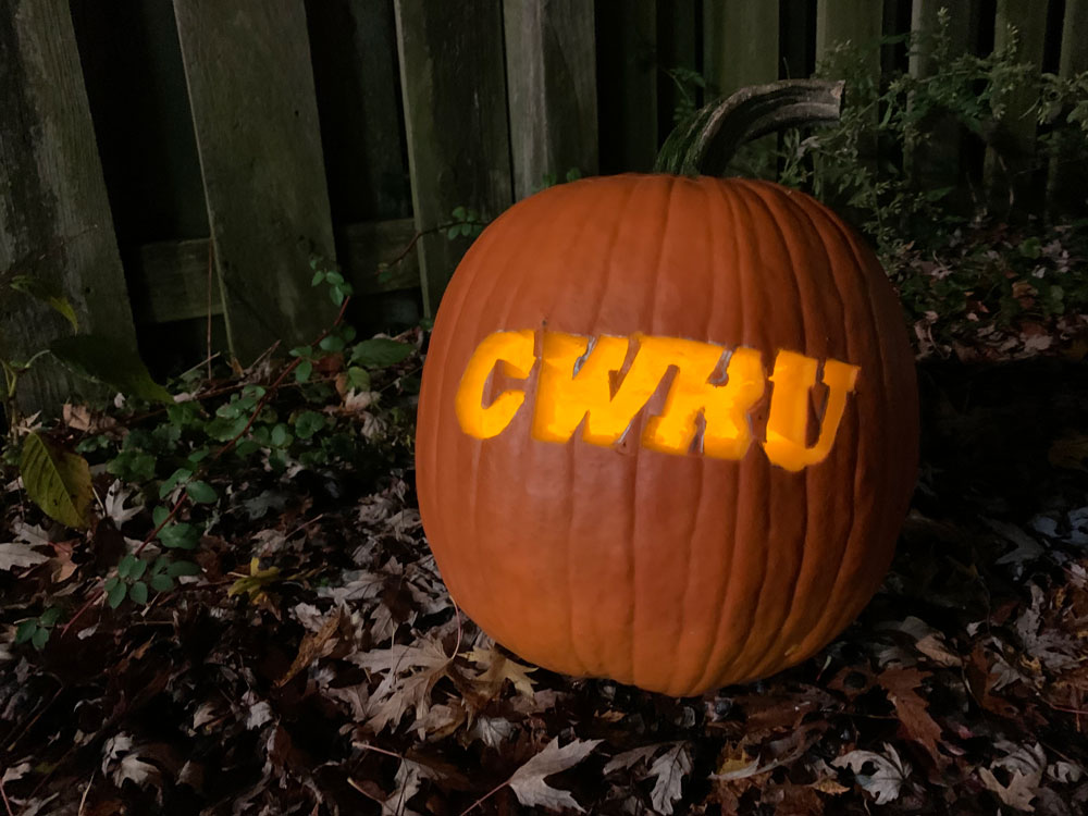 Photo of a pumpkin with CWRU carved into it