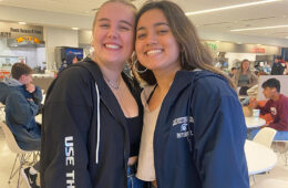 Paola Van der Linden and Nilany Rodriguez pose for a photo together inside Tinkham Veale University Center