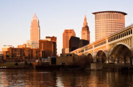 Photo of the Cleveland skyline reflecting onto the Cuyahoga River in fall