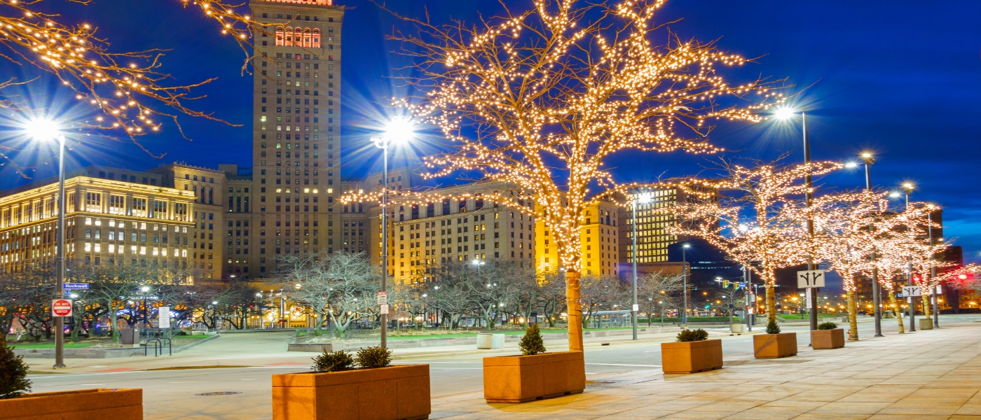 Exterior view of Cleveland with lighted trees in the winter