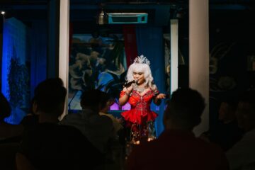 photo of drag queen performing to an audience