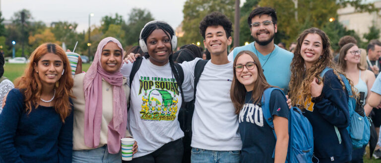 A group of diverse students smiling