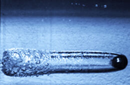high-speed, stop-action photo of a projectile in water