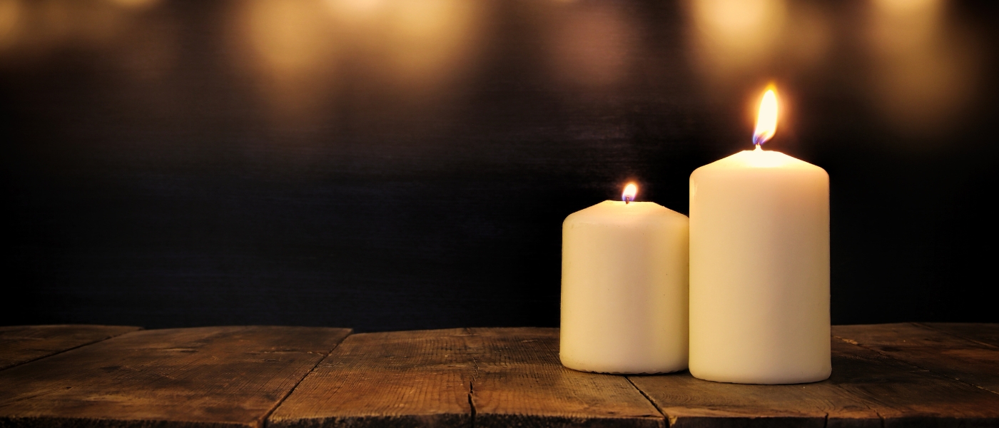 A close up of two candles