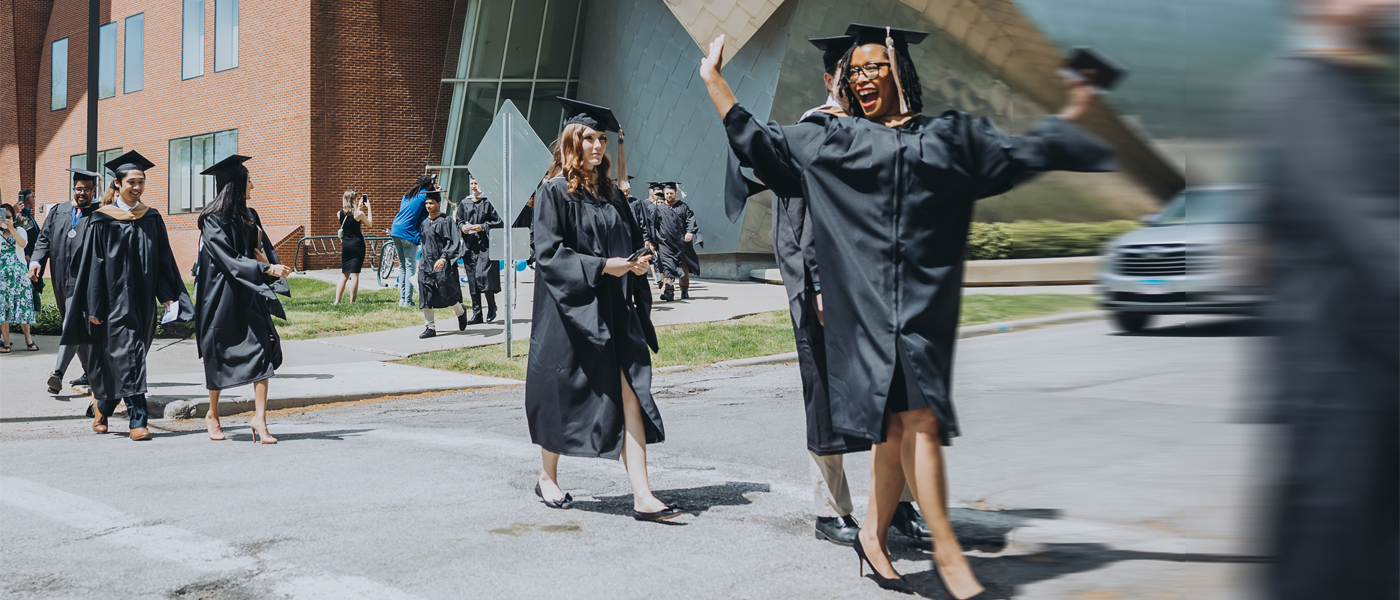 Blur shot of CWRU graduates walking outside