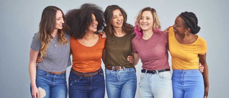 Diverse group of young women interact happily