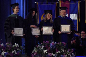 A group of John S. Diekhoff Award winners pose at commencement.